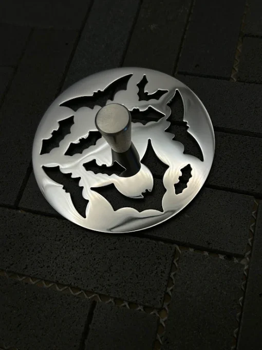 Round sink strainer in polished stainless steel finish.