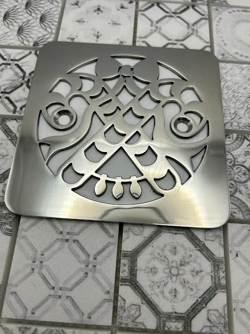 Square drain in Polished stainless steel finish.