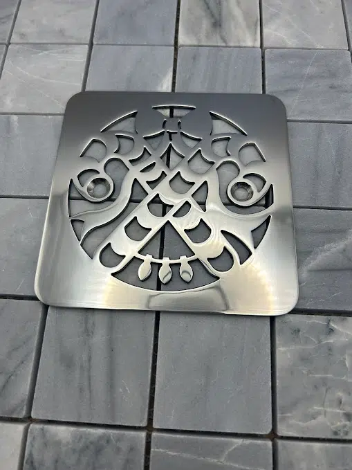 Square drain in Polished stainless steel finish.