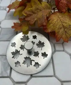 Maple Leaves kitchen stopper brushed stainless steel on tile