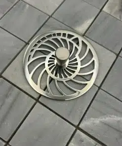 Nautilus Kitchen Sink Strainer polished stainless steel on gray tile