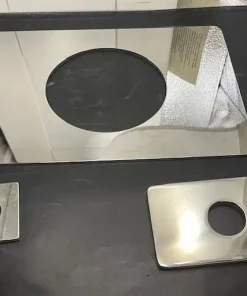 Oversized escutcheon plate covering large shower valve opening