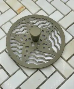 Starfish Kitchen Strainer in Champagne Bronze on white tile