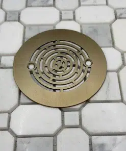 Geometric Maze 4.25 inch round shower drain in champagne bronze finish.