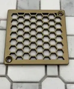 Honeycomb square shower drain in Champagne Bronze compatible with Schluter Kerdi. Option 1